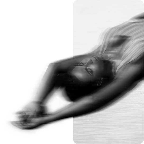 Dancer captured mid-leap, in black and white