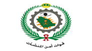 Emblem with a green wreath, crown, and Arabic text beneath a circular gear and sword icon.