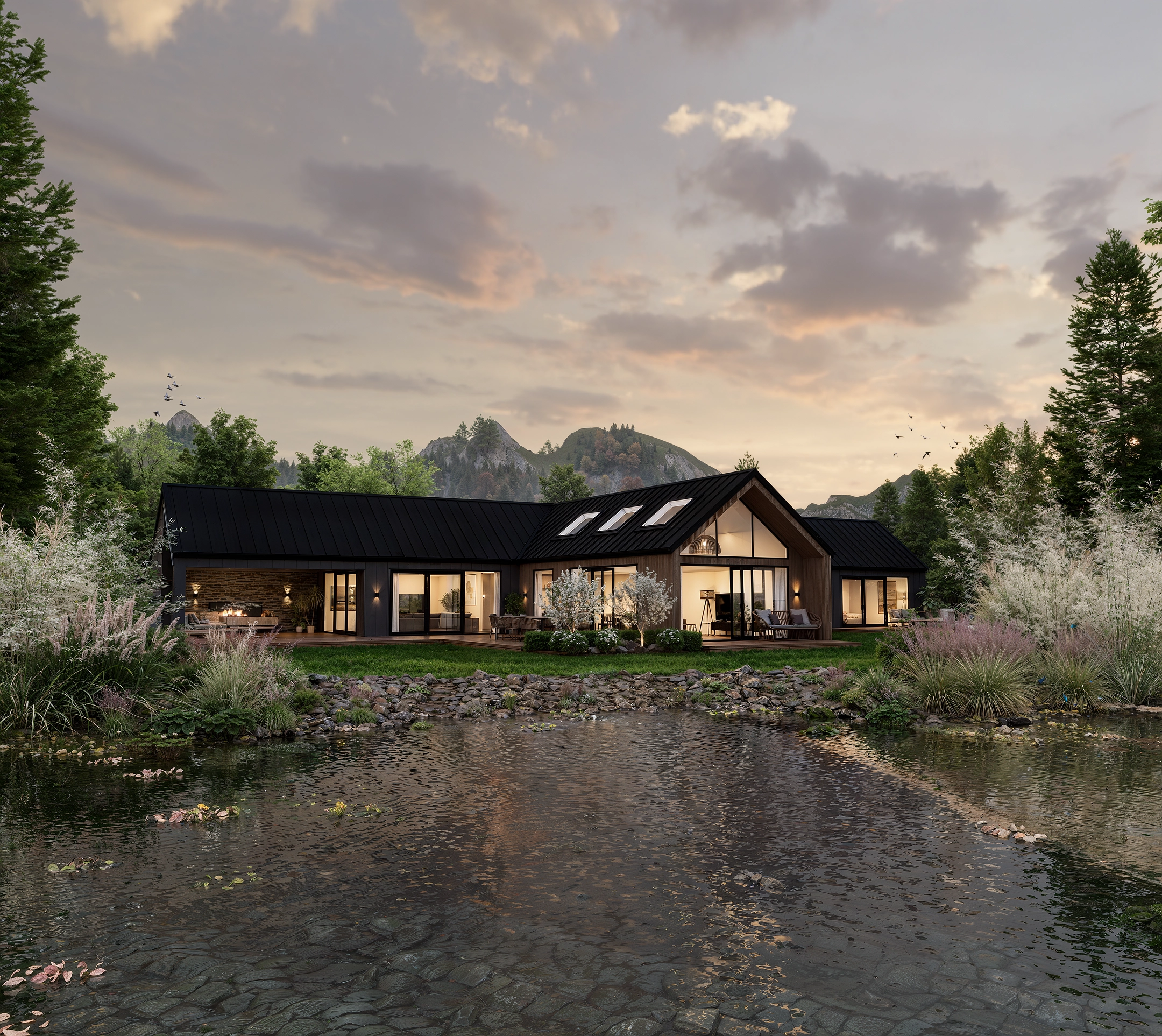 Modern L-shaped house with large windows near a pond, surrounded by trees and mountains at sunset.