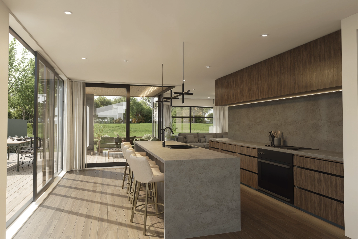 Modern kitchen with large island, beige chairs, wood cabinets, and sliding glass doors opening to a green lawn.