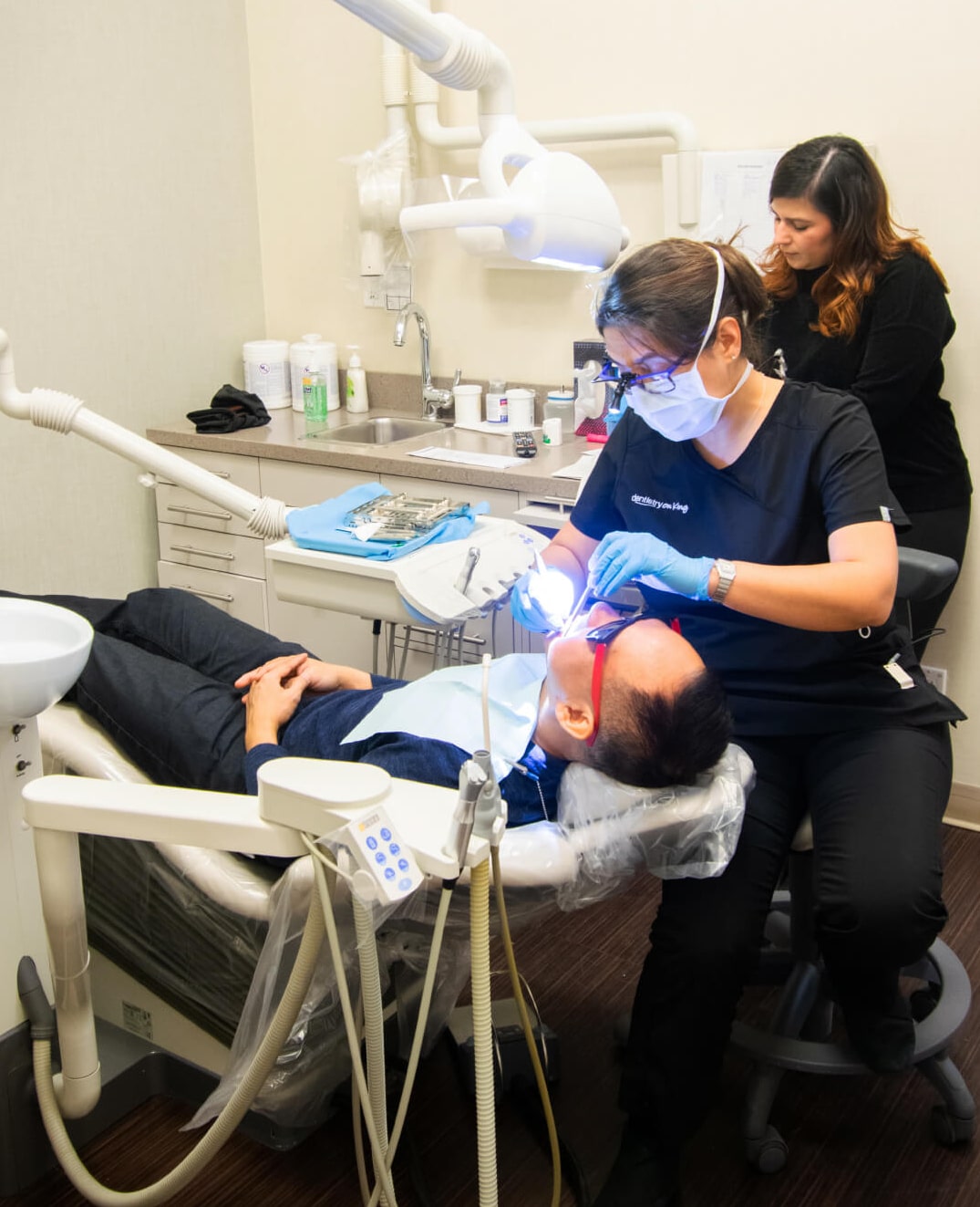 hygienist performing teeth cleaning in Toronto