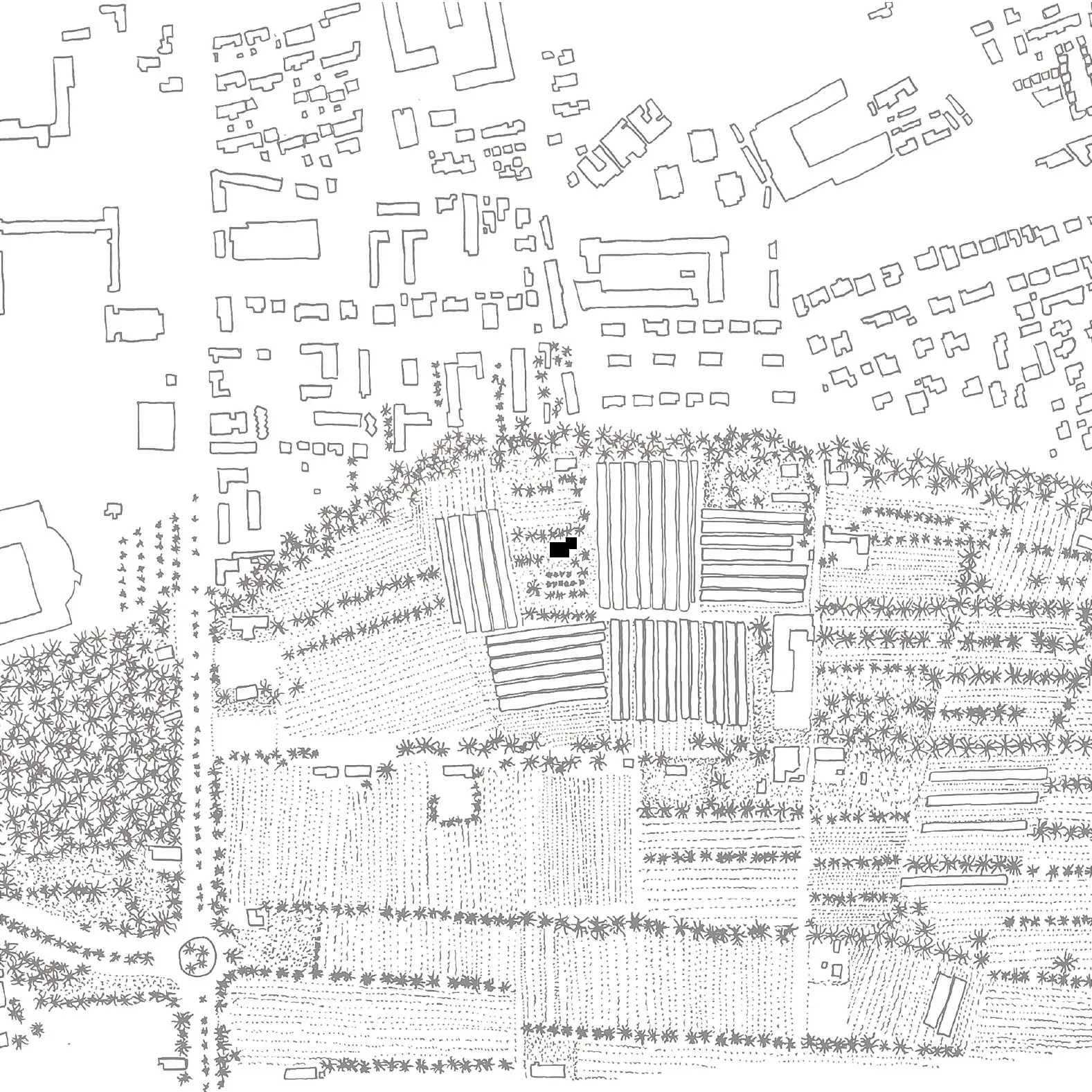Black and white map showing a town with clustered buildings, roads, and agricultural fields.