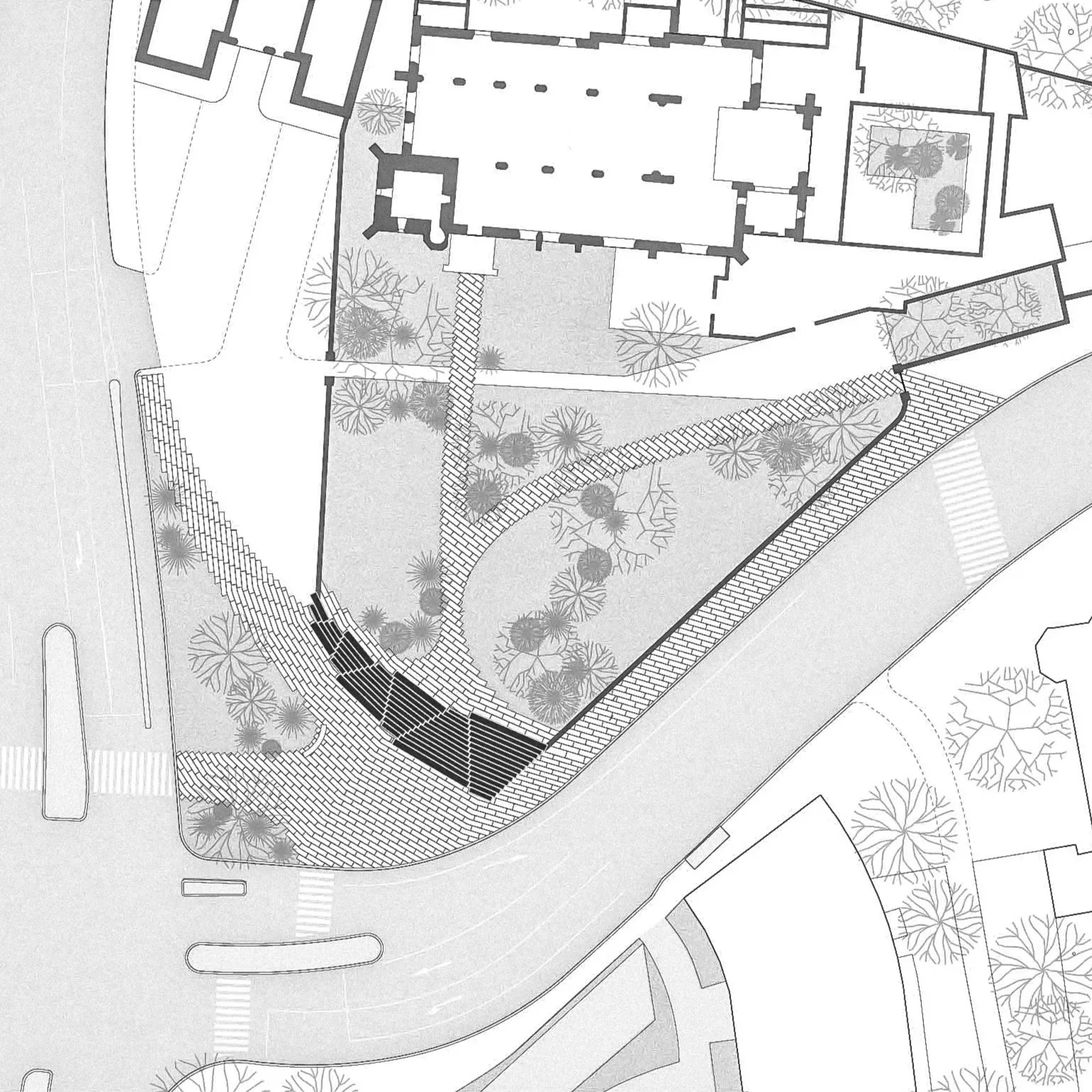 Architectural site plan showing building layout, pathways, stairs, roads, and trees in grayscale.