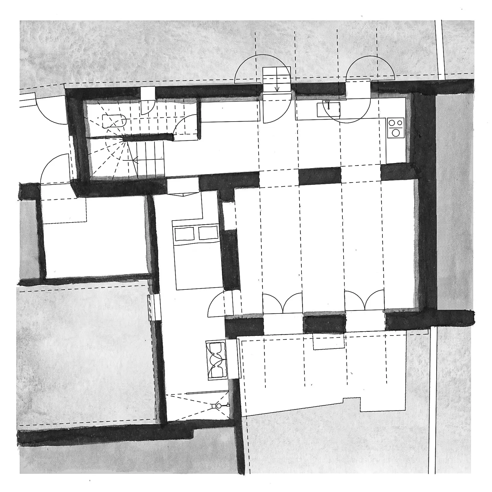Black and white architectural floor plan with rooms, doors, staircases, and furniture such as a bed and stove.