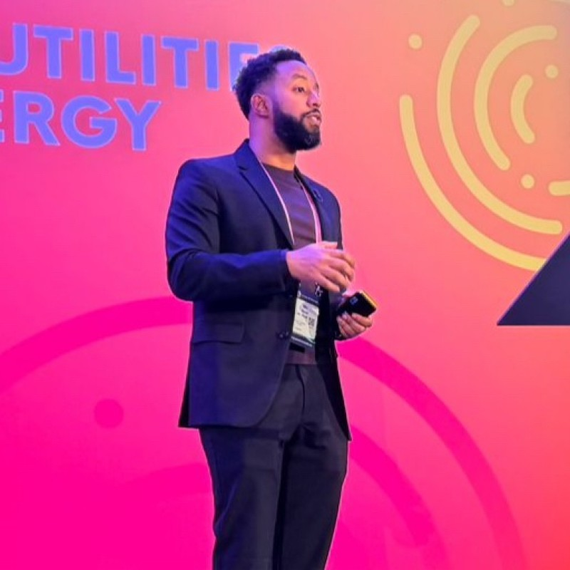 Mo Nuur, Product Lead for CX & Digital at E.ON Next, speaking on stage