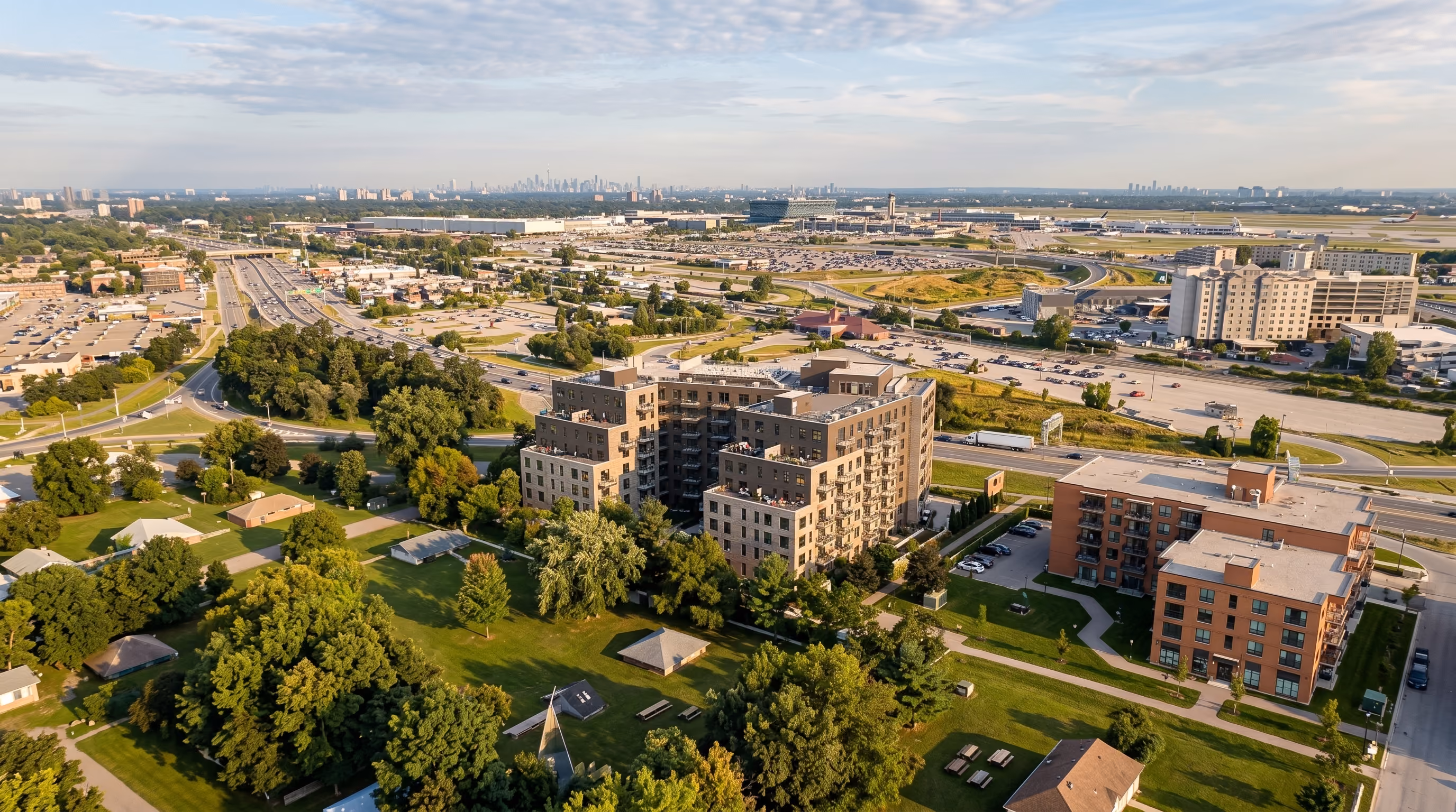 Landscaped courtyard with gardens and pathways in a high end rental Gatineau apartment complex.