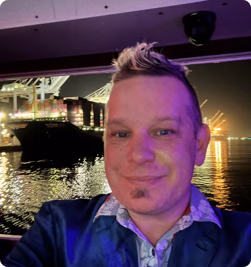 DJ Mancub by the water at night