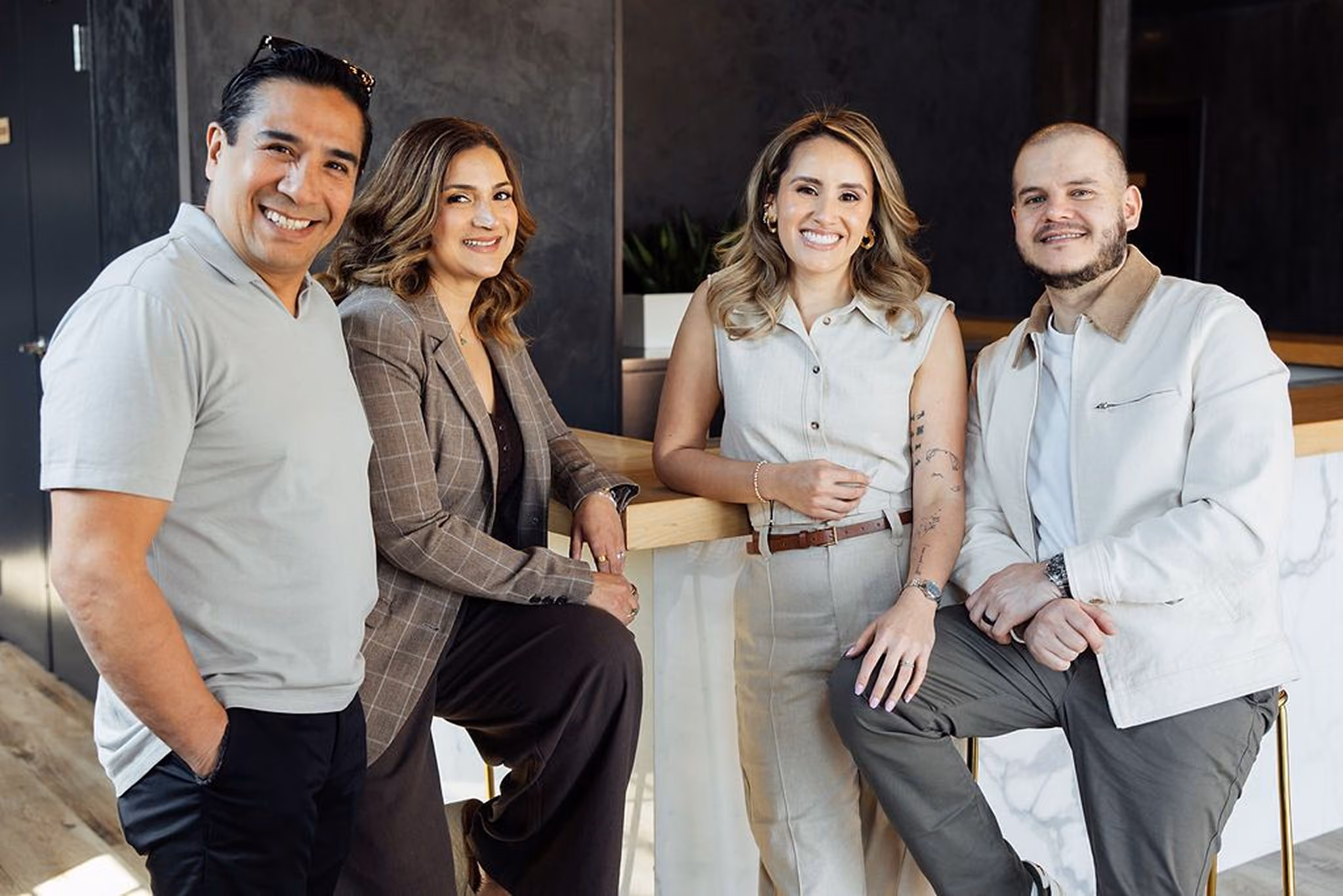 Image of the Cocina Fusion team laughing and having a conversation.