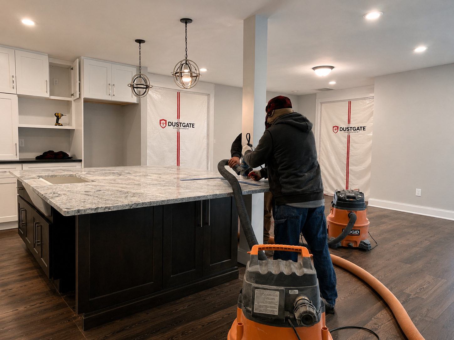 Kitchen renovation workspace with temporary dust-containment barriers protecting adjacent rooms during countertop and finish work in Davidson NC
