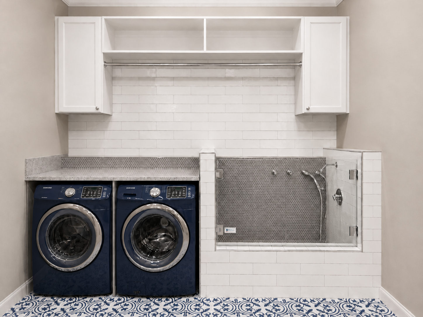Laundry room with blue front-loading appliances, white subway wall tile, gray penny-round dog-wash tile, glass splash panel, and blue-and-white patterned floor tile in Harrisburg, NC