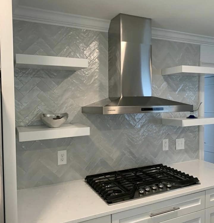Close-up of backsplash tile with clean grout lines showing how grout color affects the finished design.