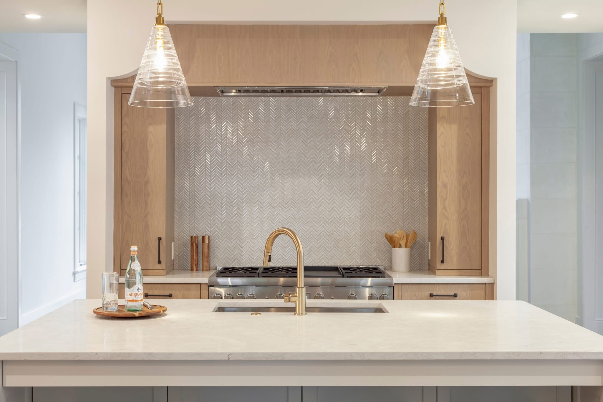 Close-up of a high-end tile installation showing clean cuts, even grout lines, and a polished finished edge.