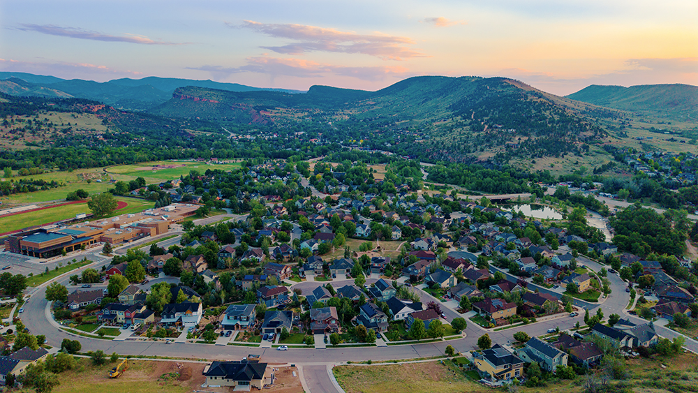 Aerial drone photo of the Lyons Valley Park neighborhood in Lyons, Colorado, set in a valley where the plains meet the foothills.