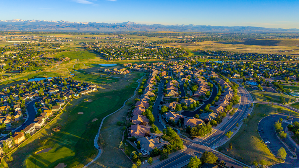 Aerial drone photo of Erie, Colorado, a fast-growing town on the Boulder–Weld county line with a historic downtown core.
