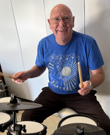 Charlie happily drumming to his own beat, as usual.