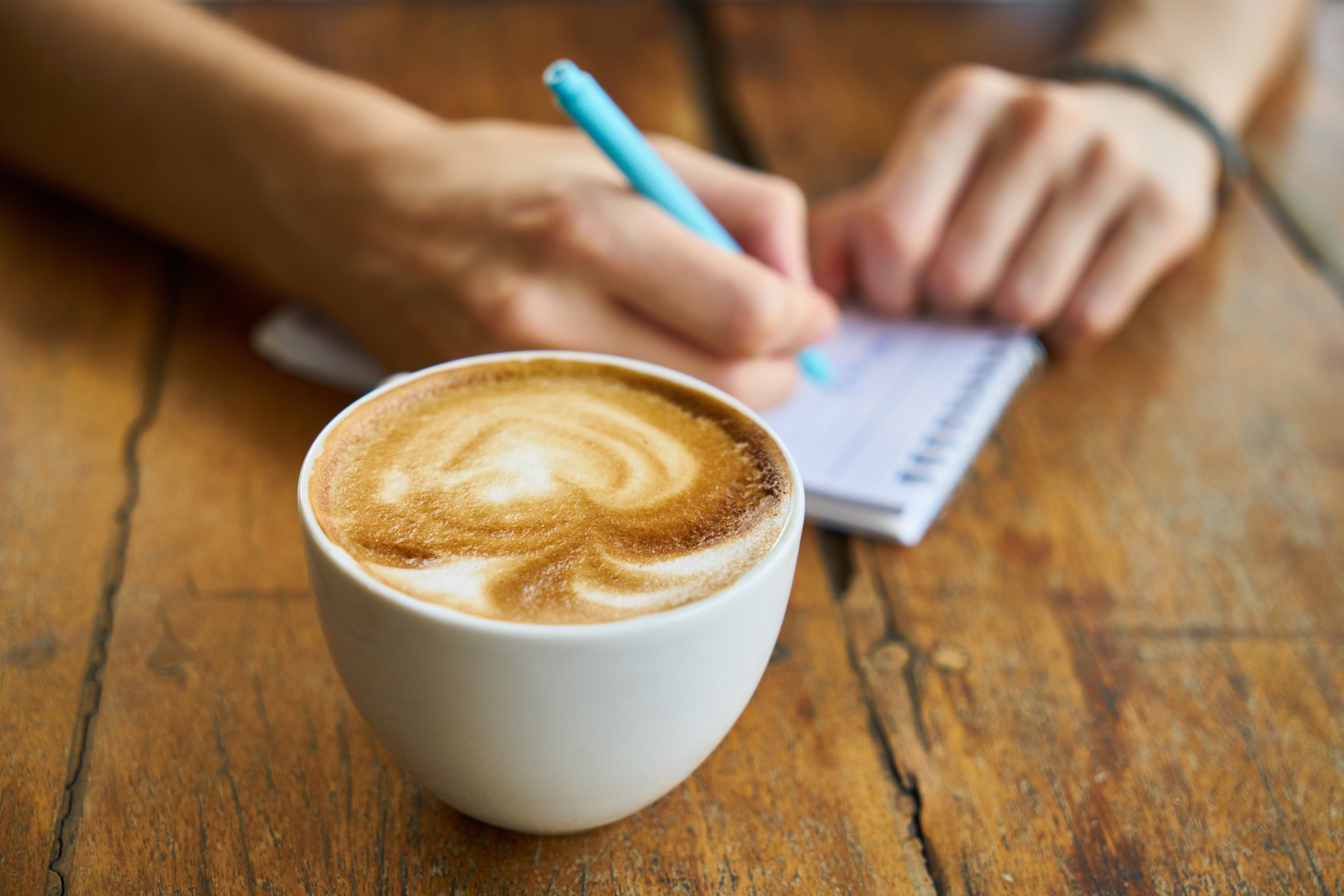 Enjoying a cup of coffee while participating in a group discussion
