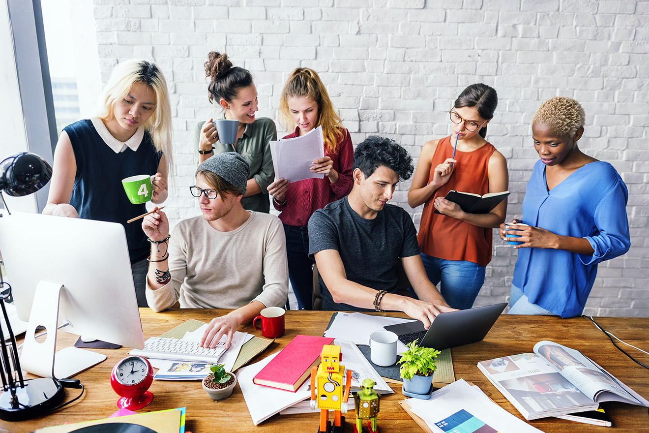 a group of people sitting around a table