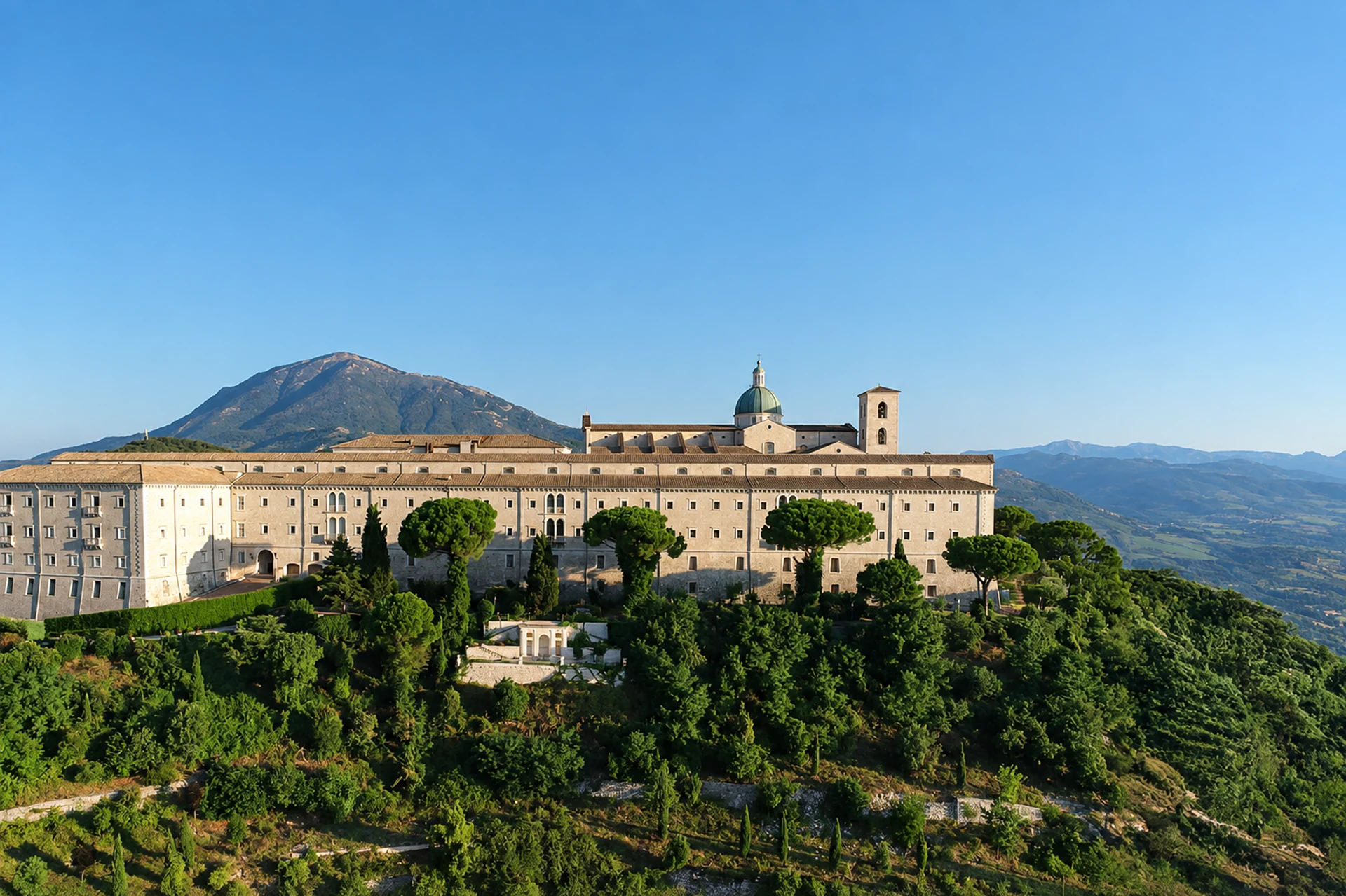 Hilltop abbey beneath blue mountain skies