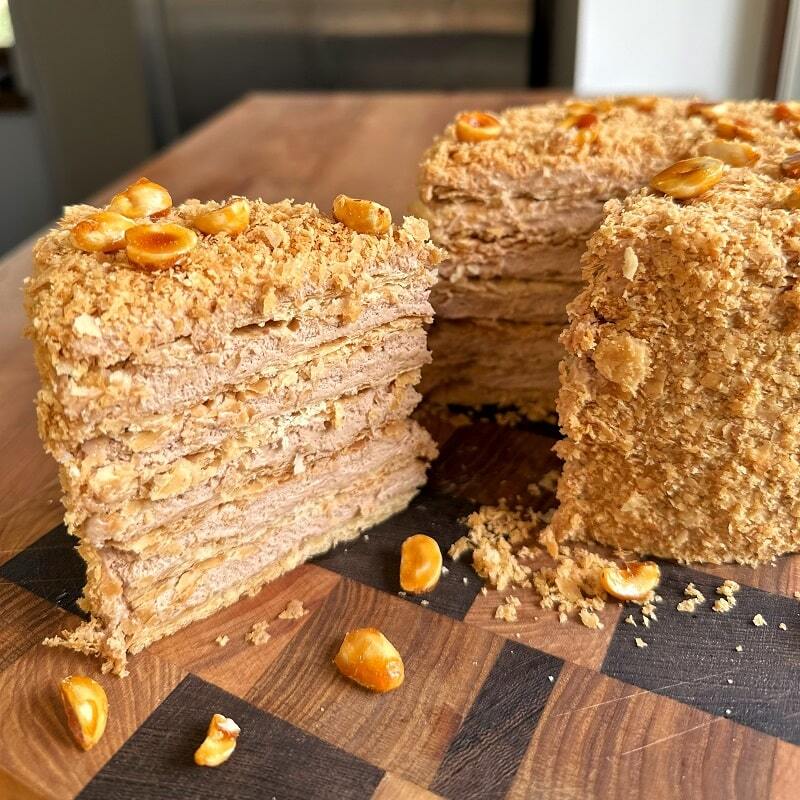 Slice of Napoleon cake showing crisp flaky layers and cream