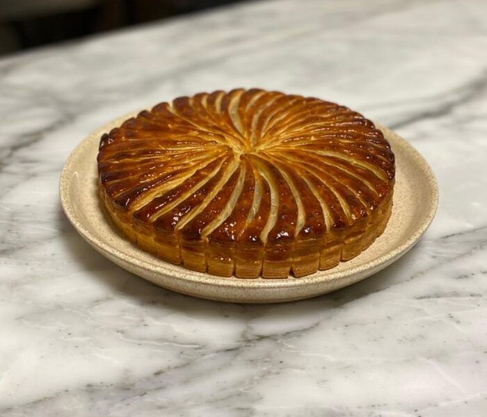 Royal puff pie with tall burnished layers