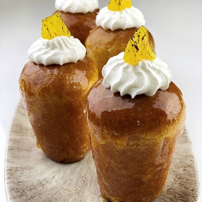 Modern rum baba under apricot glaze