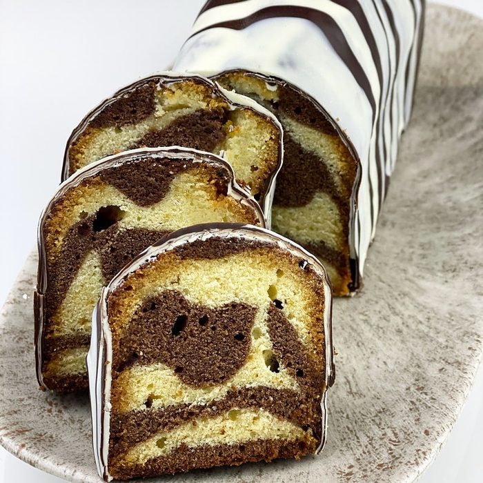 Striped zebra loaf cake under dark chocolate glaze