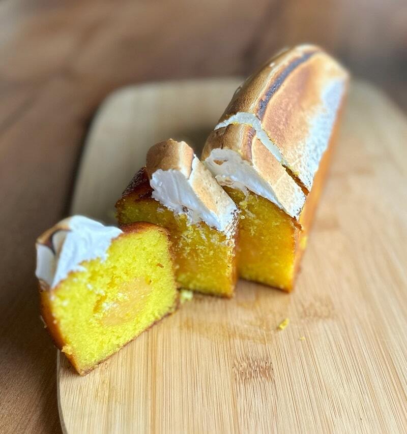 Sliced layered loaf cake with clean distinct filling layers