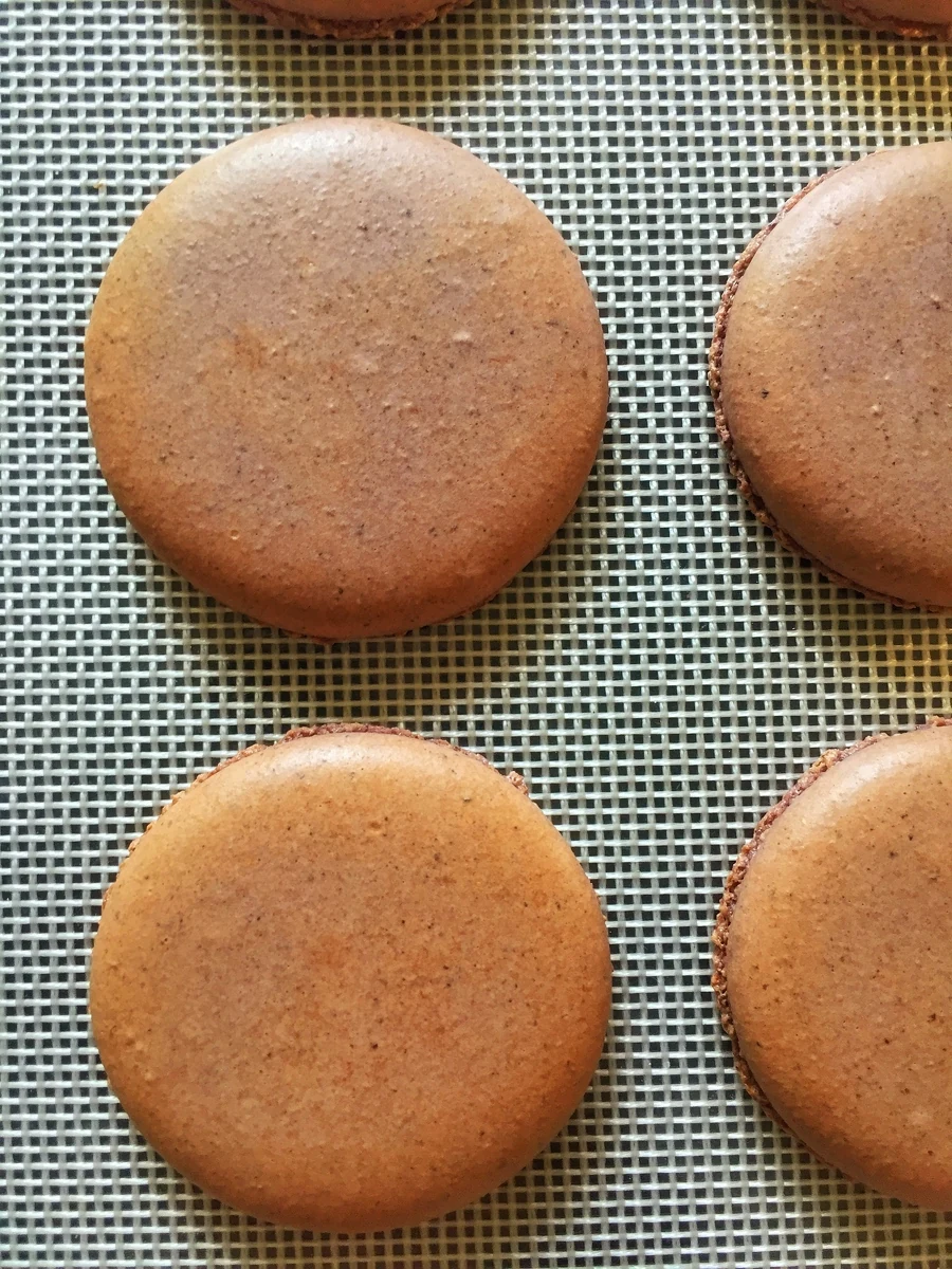 Macaron shells with darker colour around their outer edges