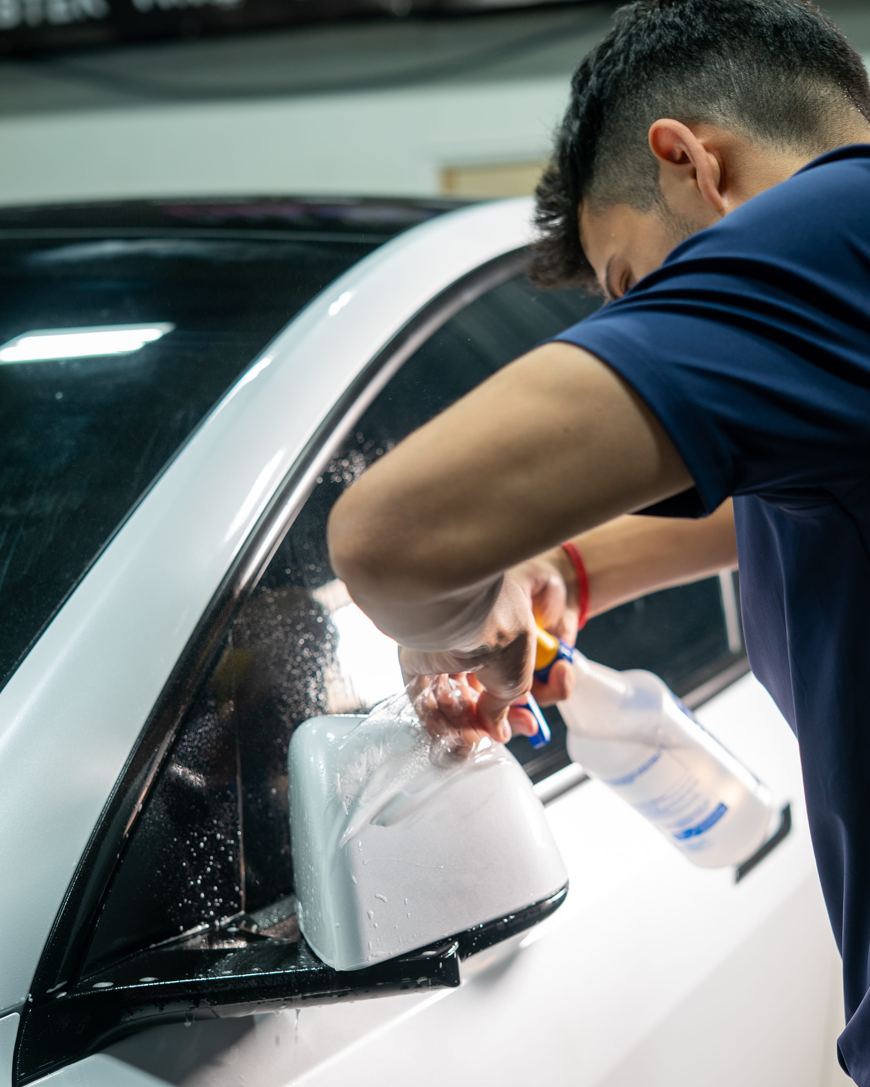 image of a car enthusiast examining a vehicle