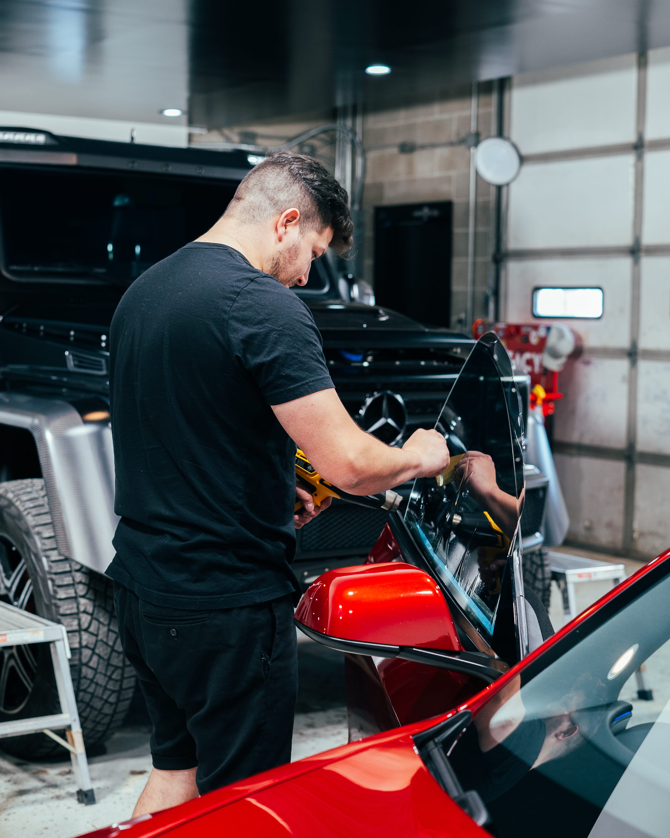 image of a car enthusiast examining a vehicle