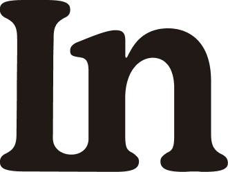 Close-up of black lowercase letters 'I' and 'n' on a white background.