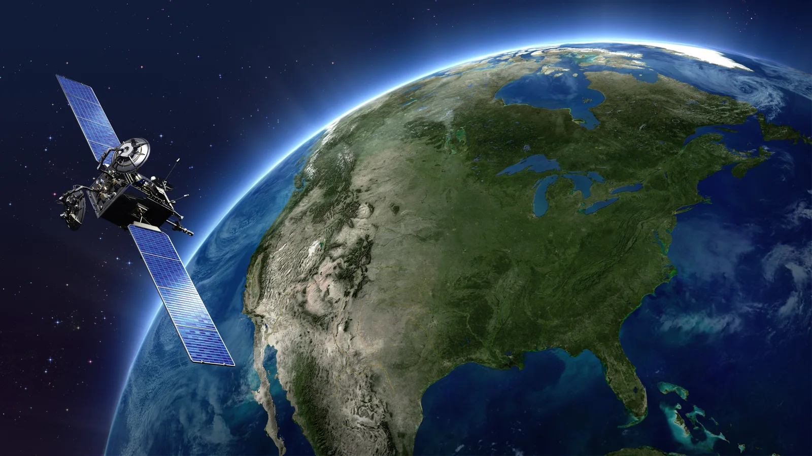 A communications satellite orbiting above North America enabling space-based ADS-B surveillance
