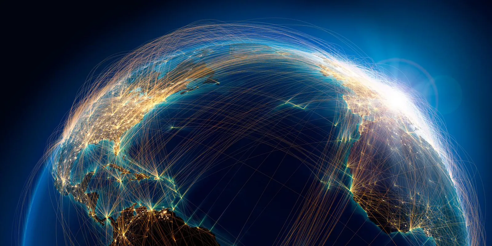 Night view of the globe showing the dense transatlantic air route network across the North Atlantic