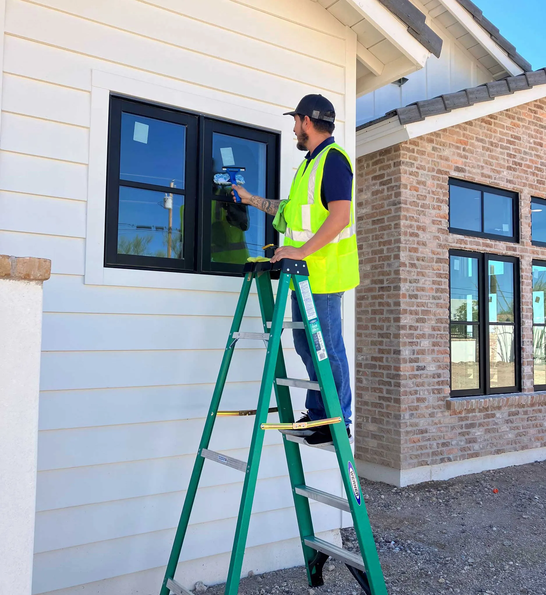 A man cleaning the window