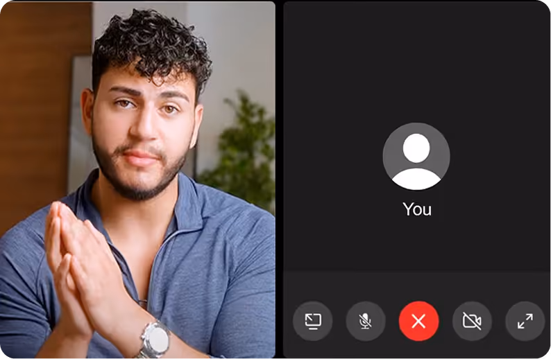 Man with curly hair and beard wearing blue shirt speaking in a video call with black screen participant panel.
