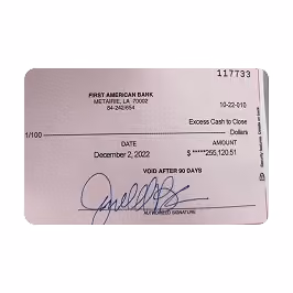 Bank check from First American Bank dated December 2, 2002, signed and payable for $25,120.51.