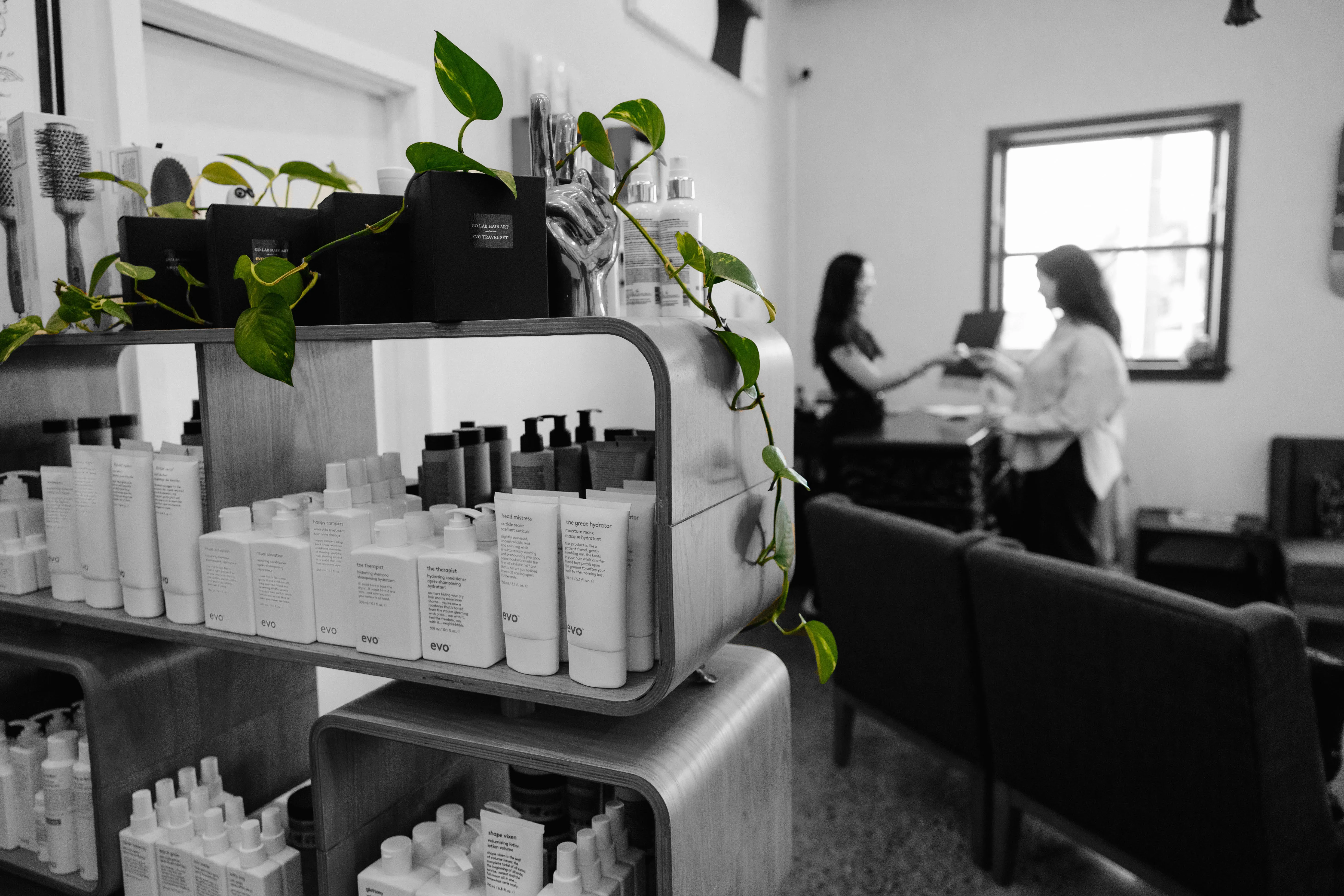 A black and white picture of hair products