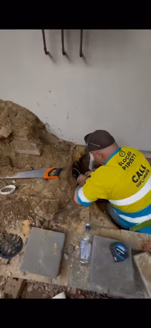 Plumber working at the access point