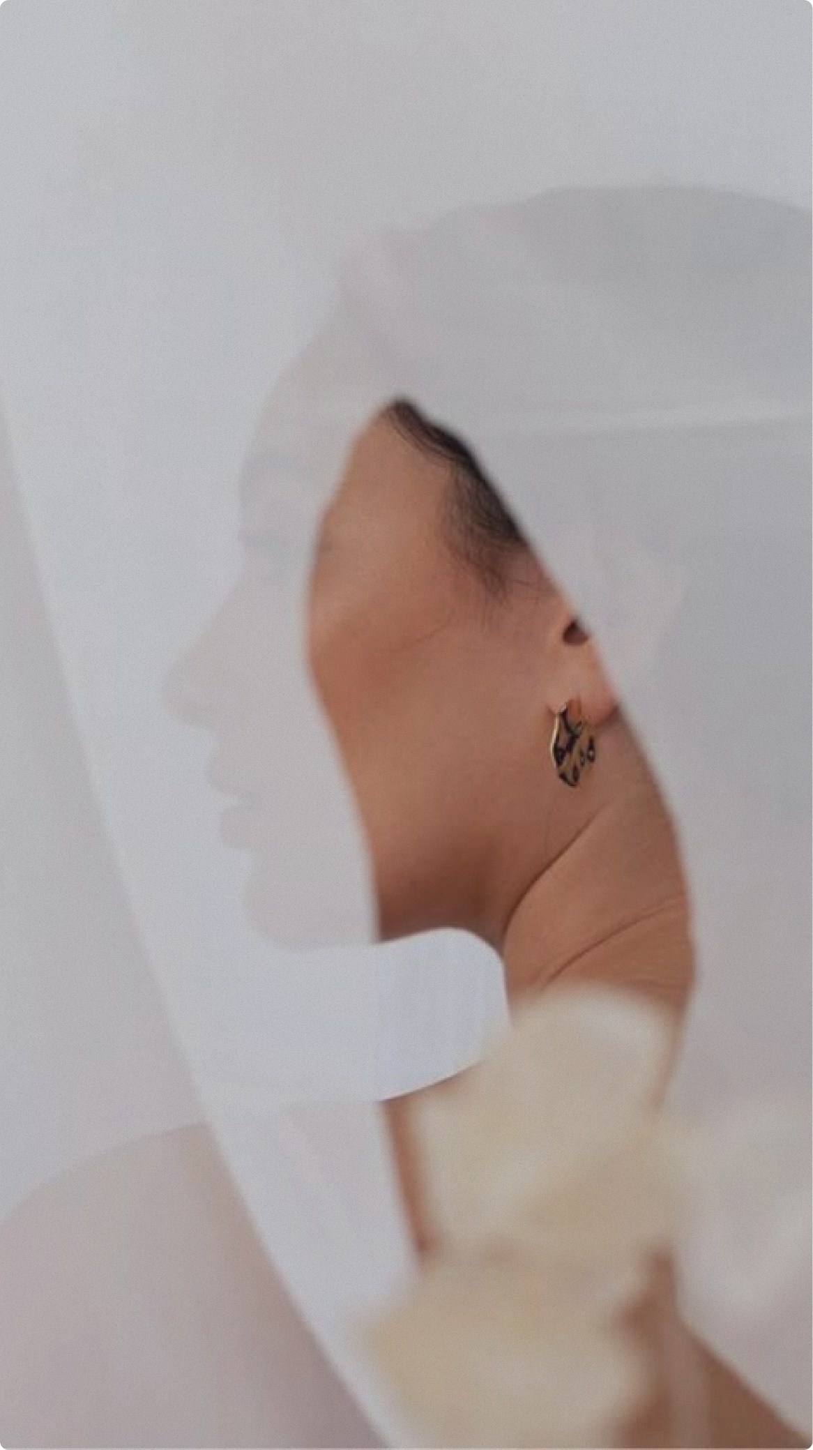Woman in profile with veil
