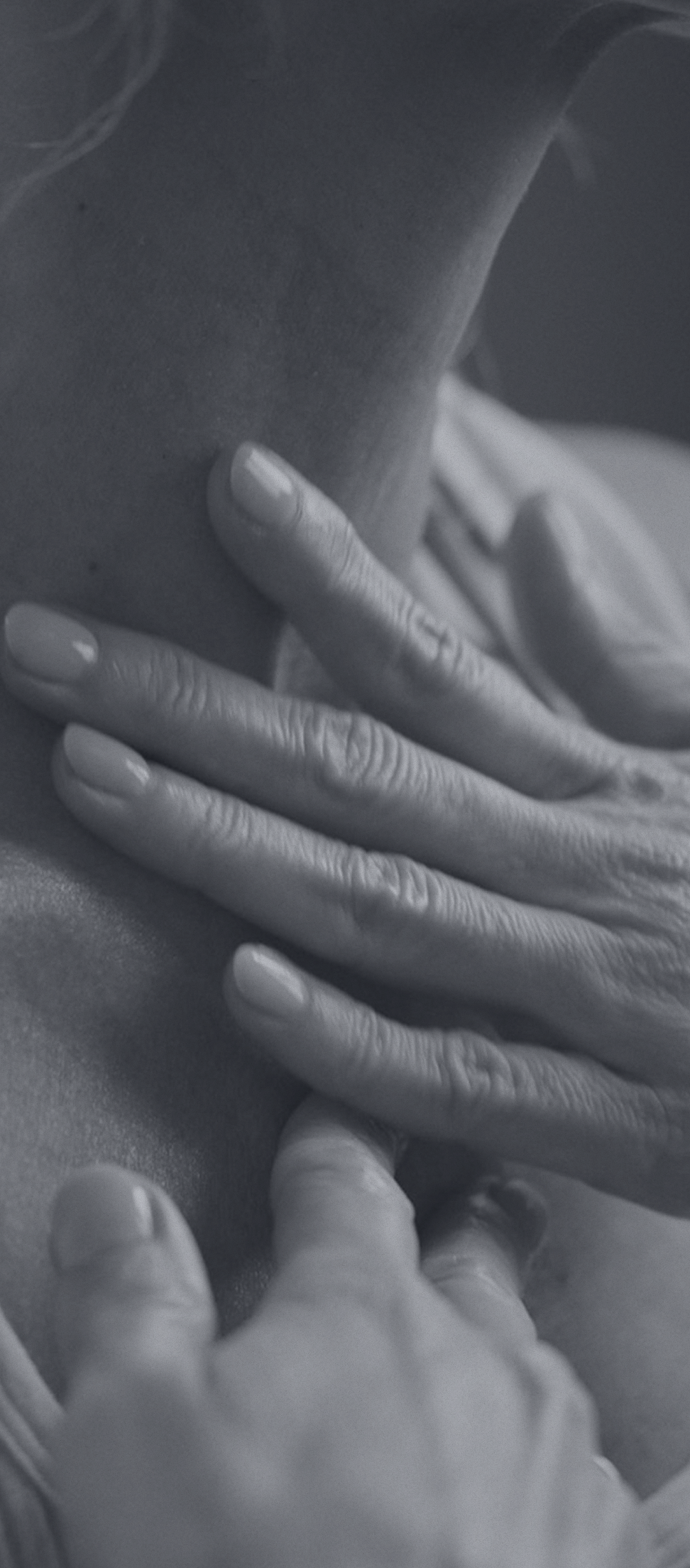 Hands resting gently on a shoulder