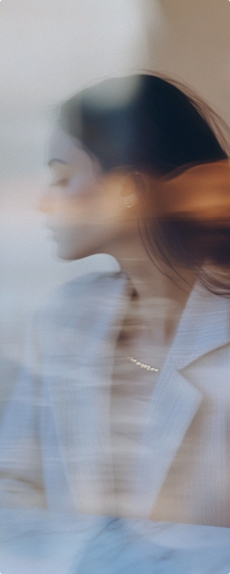 Woman in motion, close-up portrait with soft natural lighting