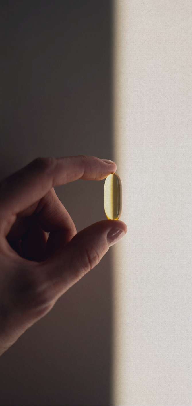 Assorted supplement capsules arranged on a surface