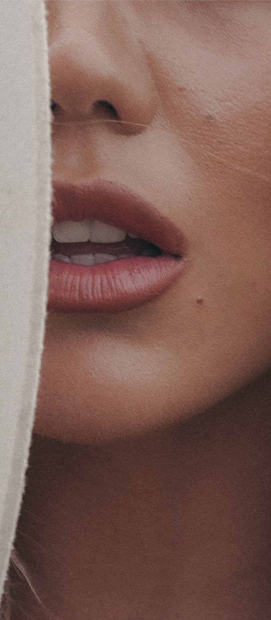 Close-up of a woman's cheek and skin texture