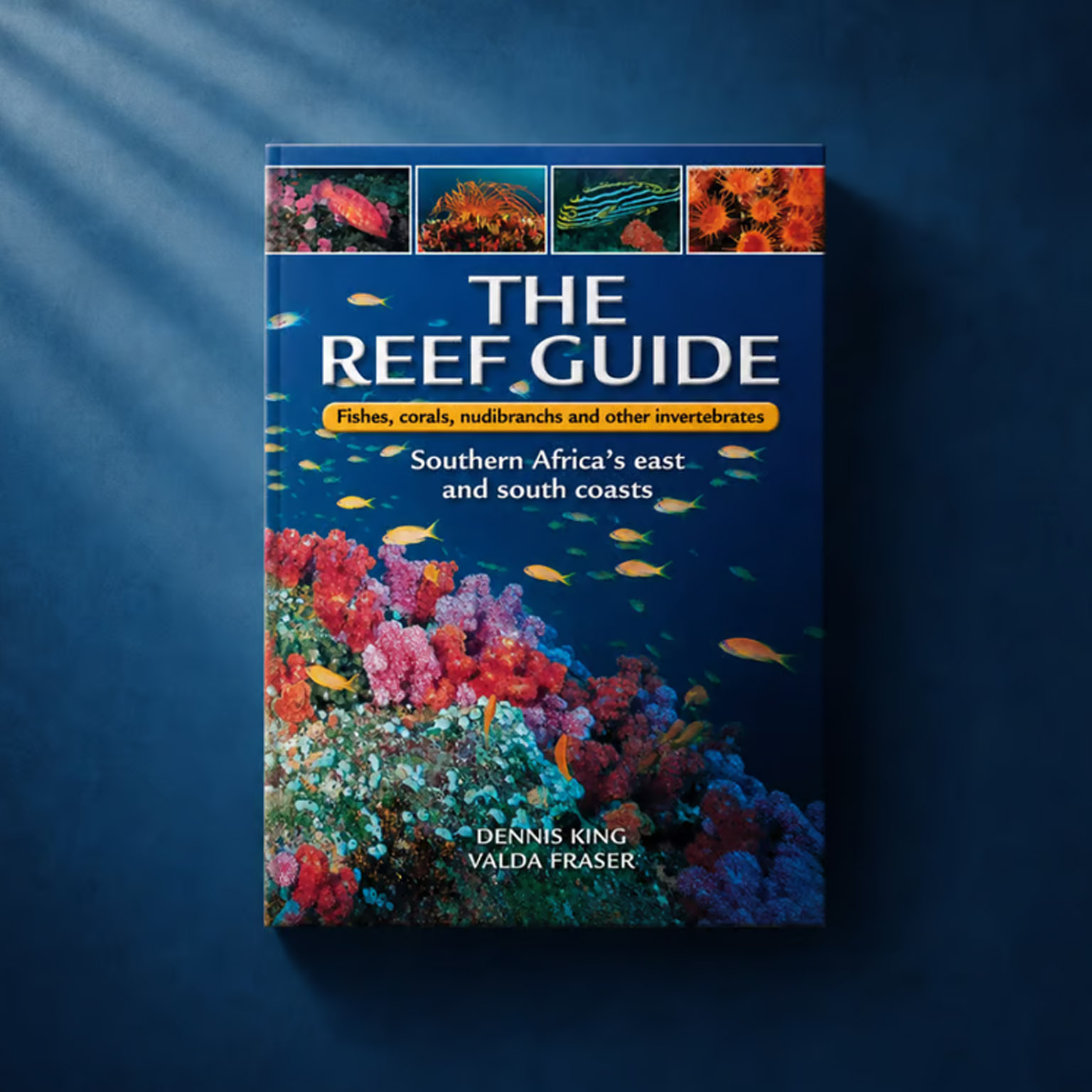 Book cover of The Reef Guide with colorful coral reef and fishes from Southern Africa's east and south coasts.
