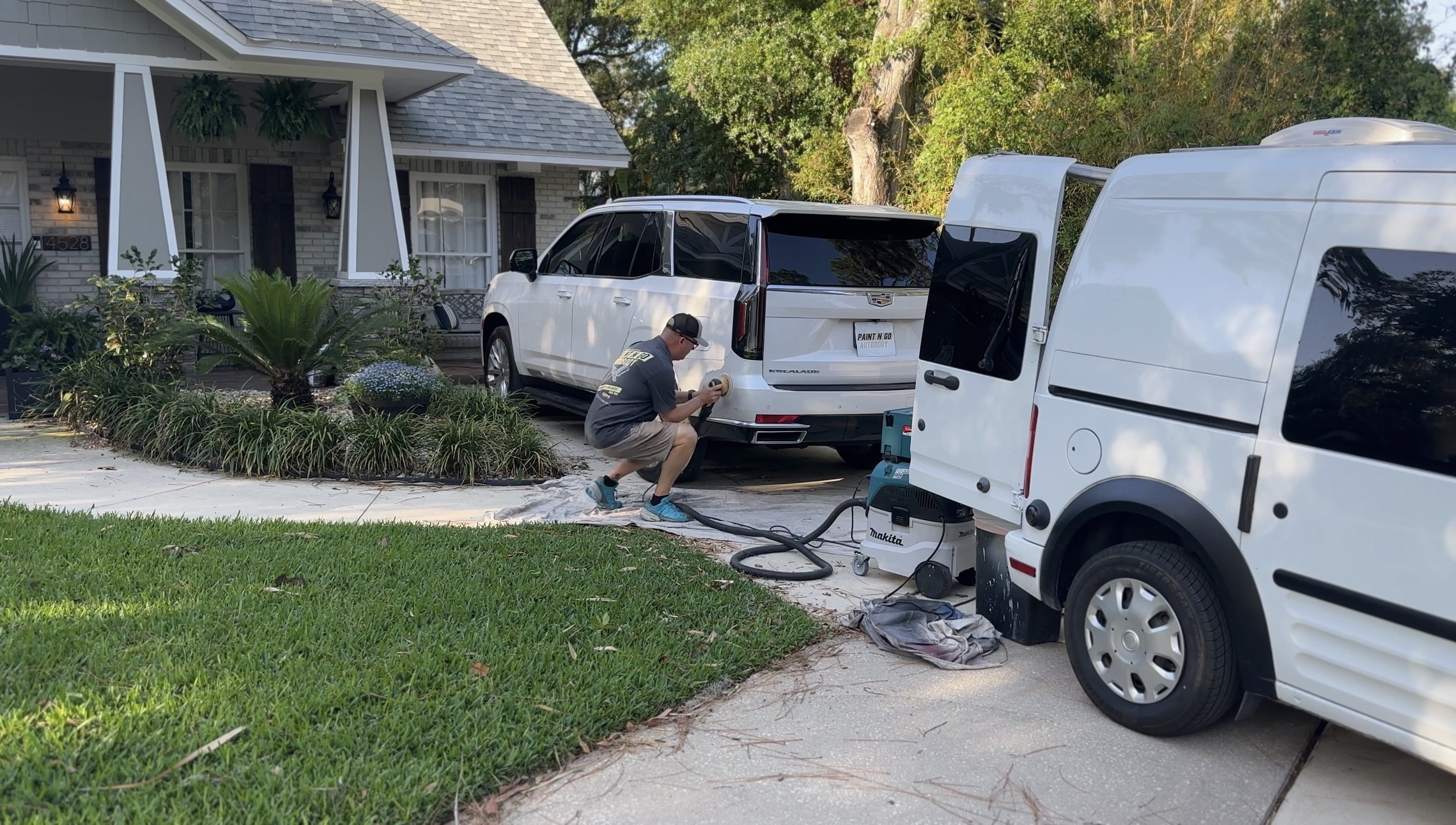 Paint N Go technician performing mobile auto body repair at a customer's location