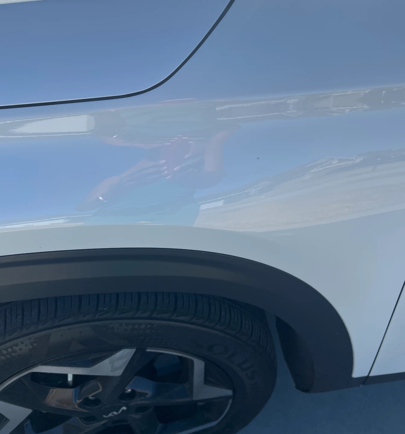 image of mechanics at work on a car