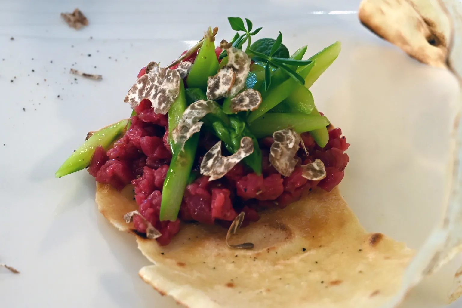 Bianchetto truffle slices over tartare with asparagus