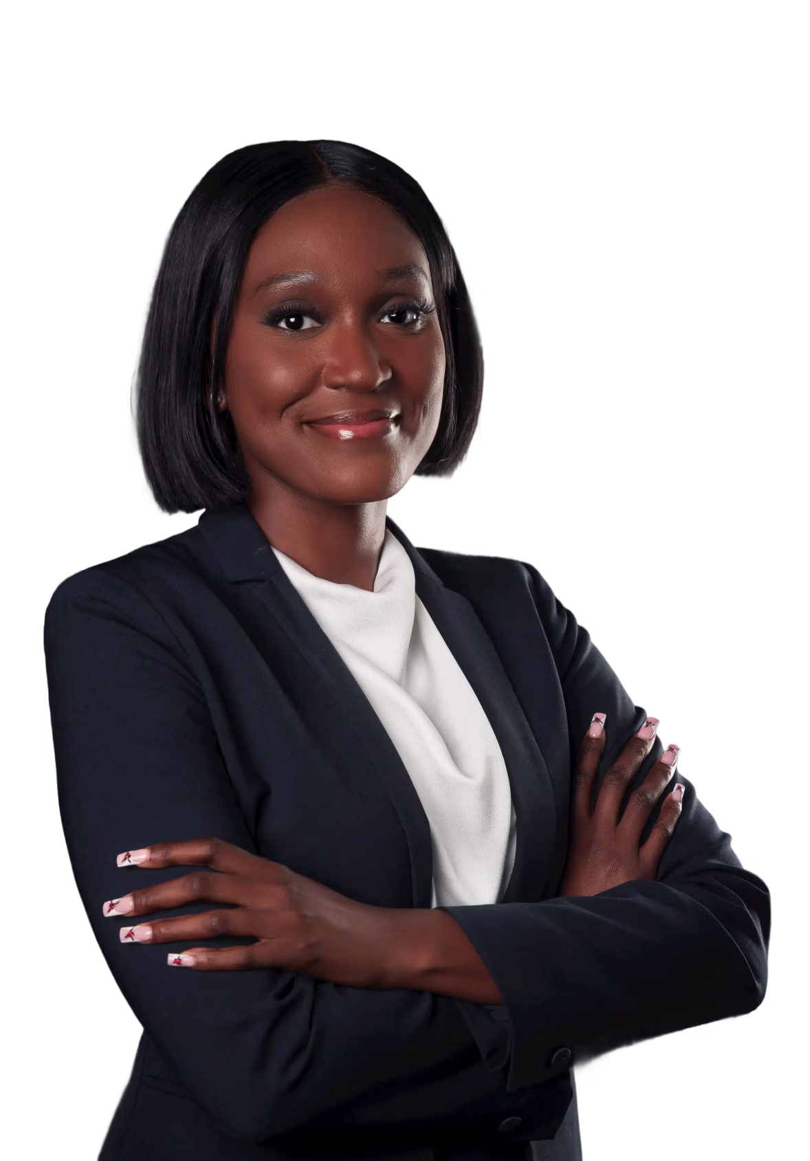 Confident woman with short black hair wearing a navy blazer and white top, arms crossed, smiling.