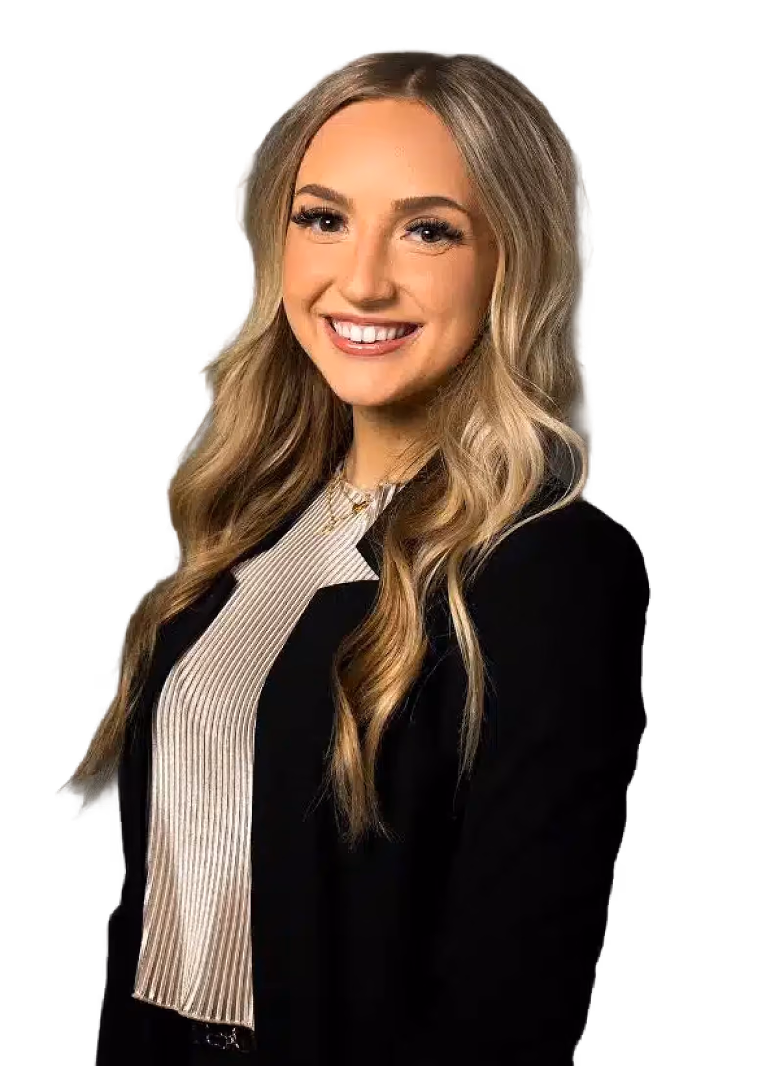 Smiling young woman with long blonde wavy hair wearing a black blazer and striped blouse.