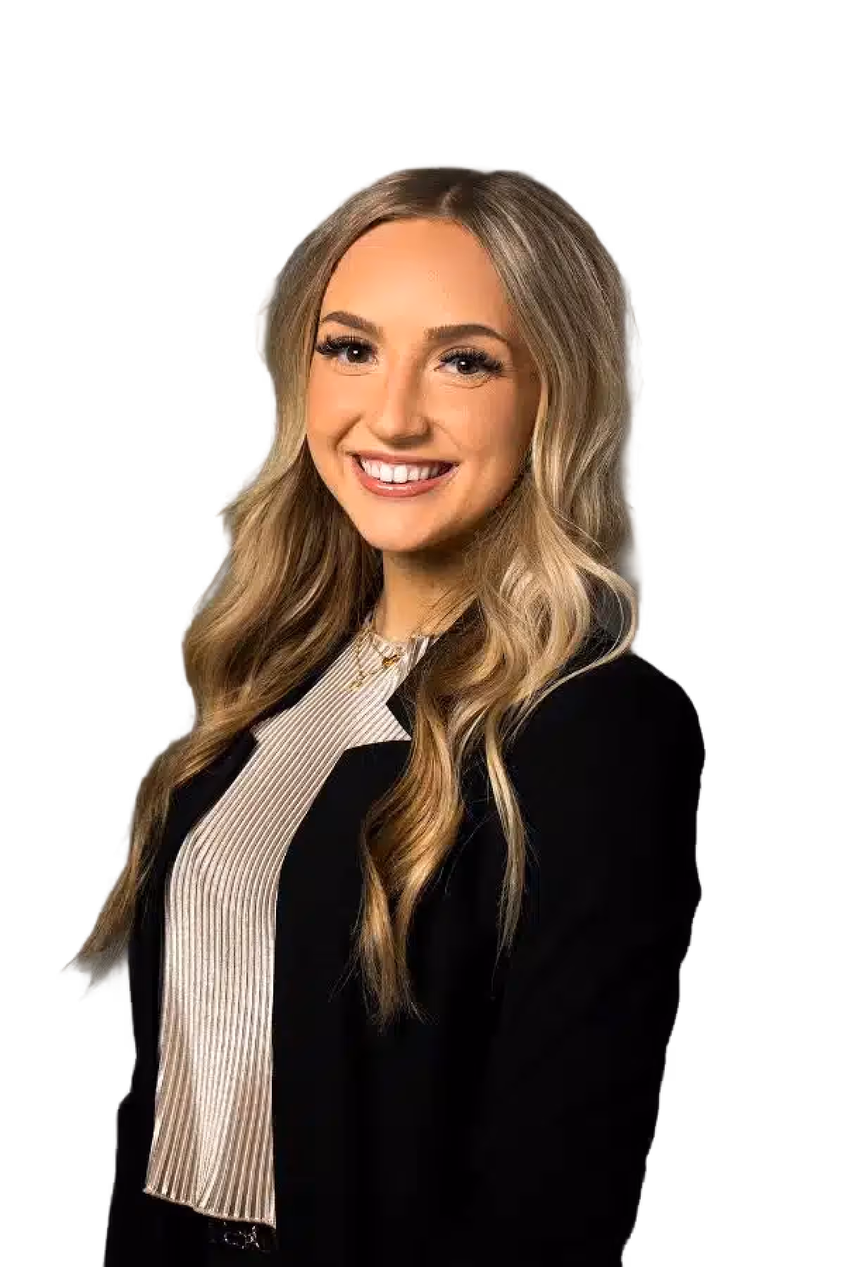 Smiling young woman with long blonde wavy hair wearing a black blazer and striped blouse.
